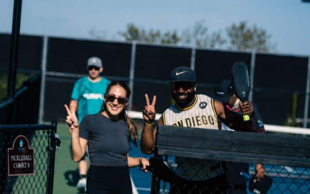 Ethos team members on a pickleball court