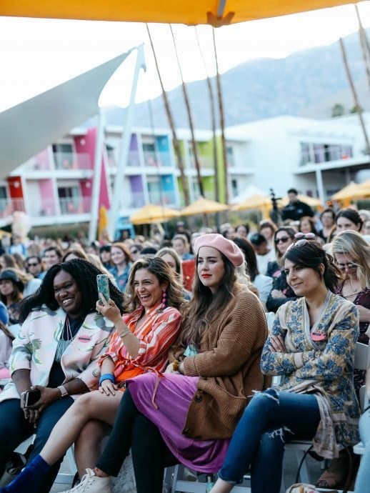 Audience laughing during an outdoor session at a Palm Springs hotel