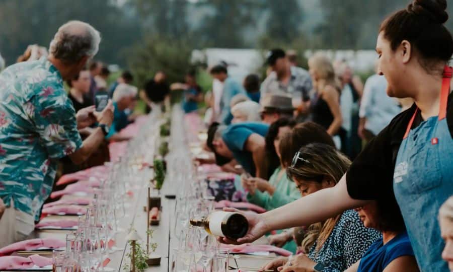 Guests sharing a long-table meal