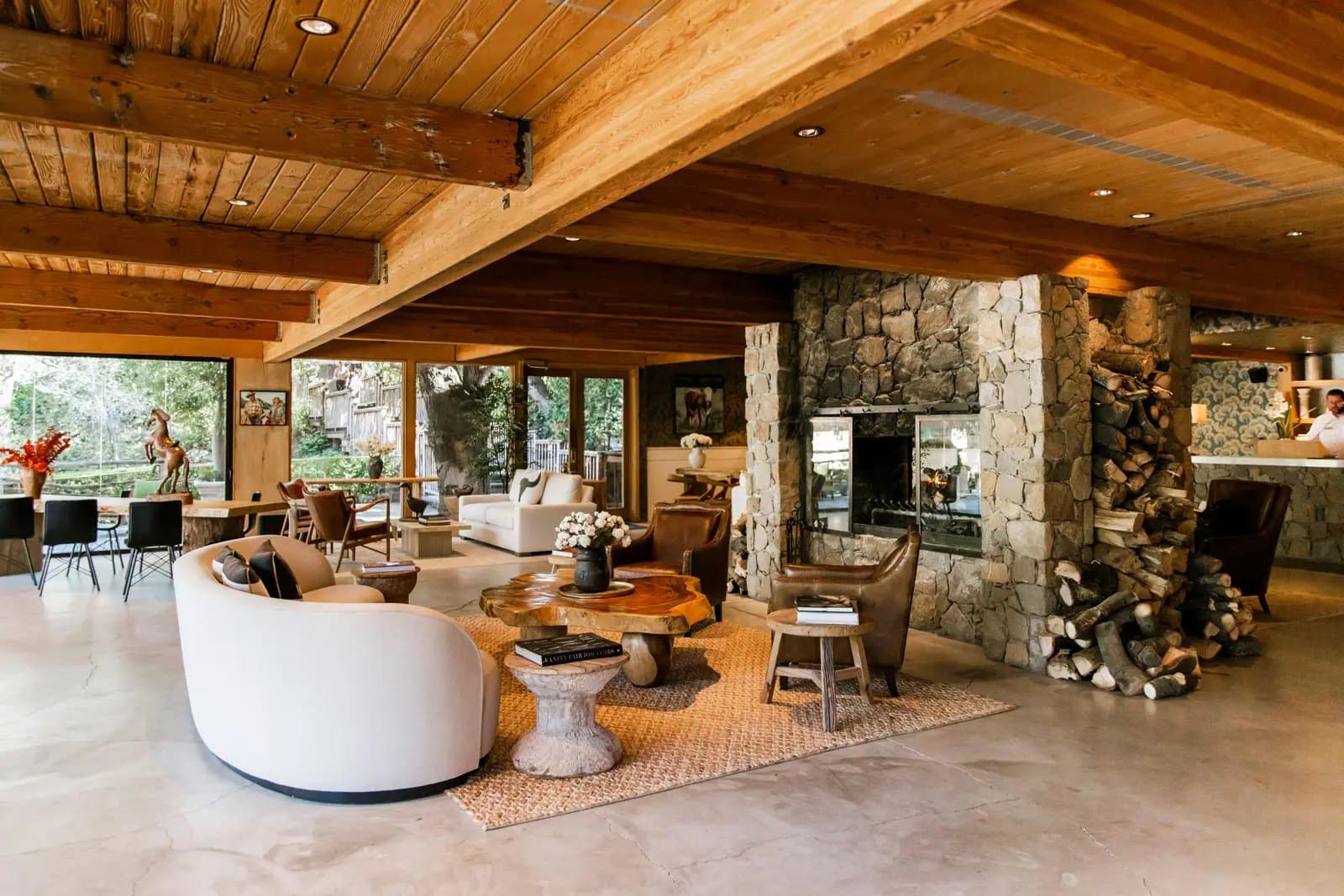 Lodge lounge with a stone fireplace at Calamigos Ranch in Malibu