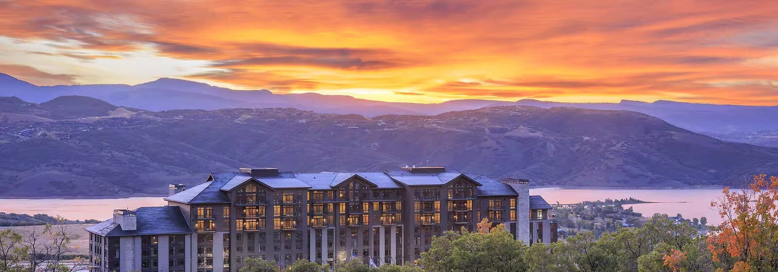 Grand Hyatt Deer Valley at sunset above Jordanelle Reservoir