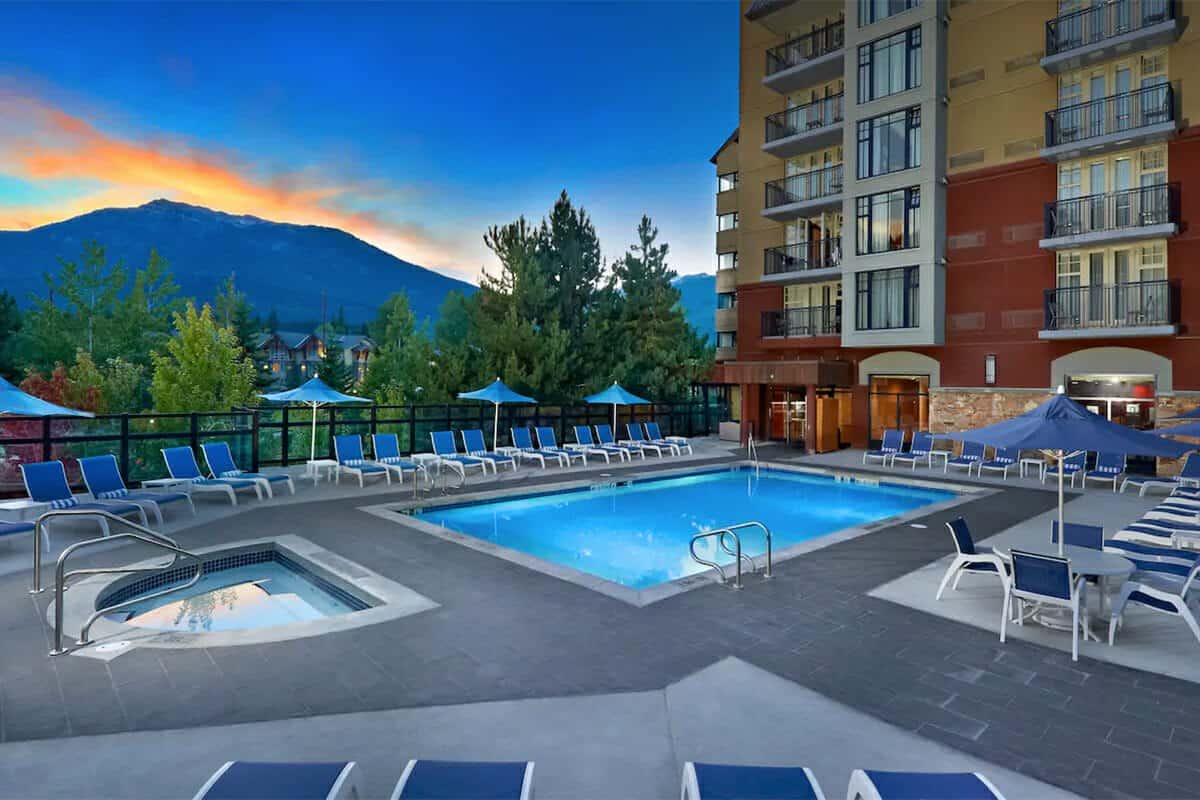 Pool and hot tub at Hilton Whistler Resort at sunset