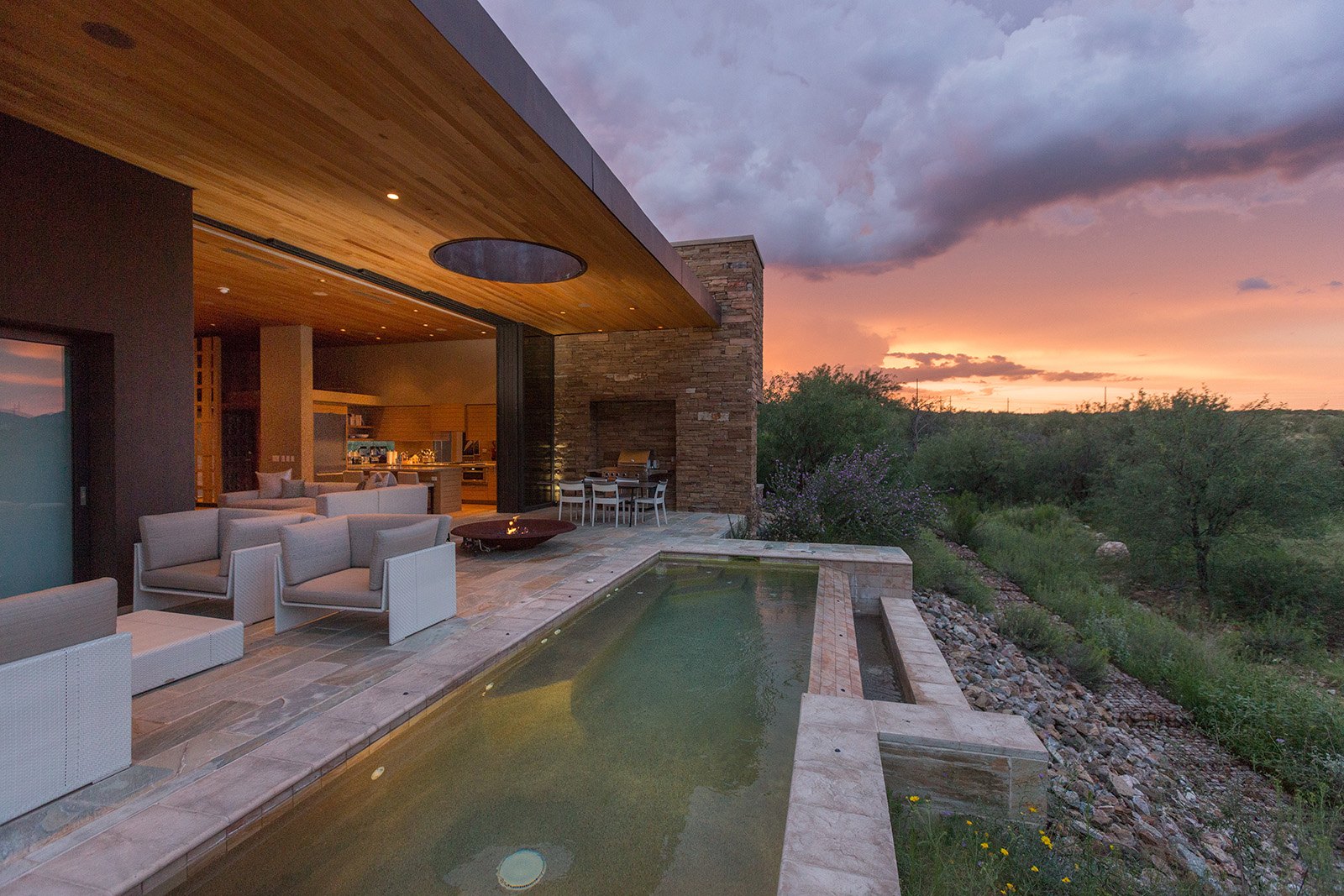 Covered terrace and plunge pool at sunset at Miraval Arizona
