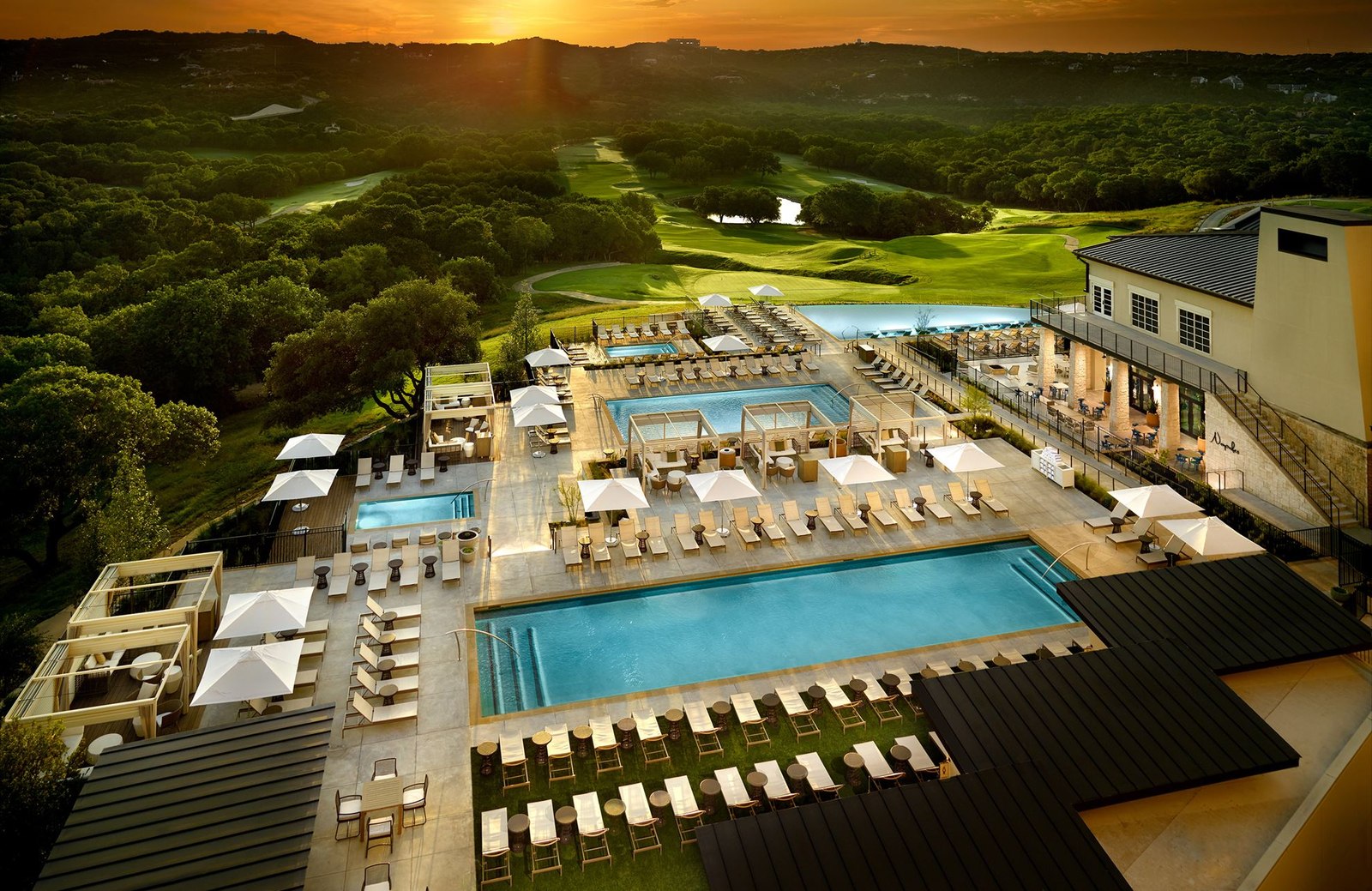 Pools and golf course at Omni Barton Creek at sunset, Austin