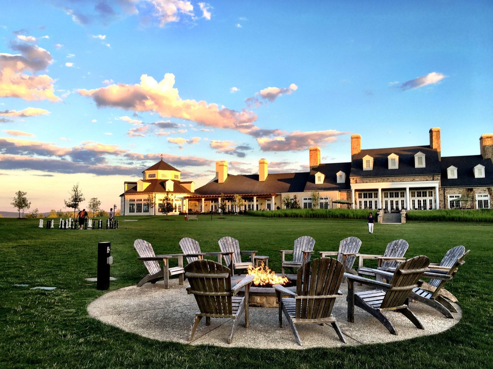 Fire pit on the lawn at Salamander Middleburg at sunset