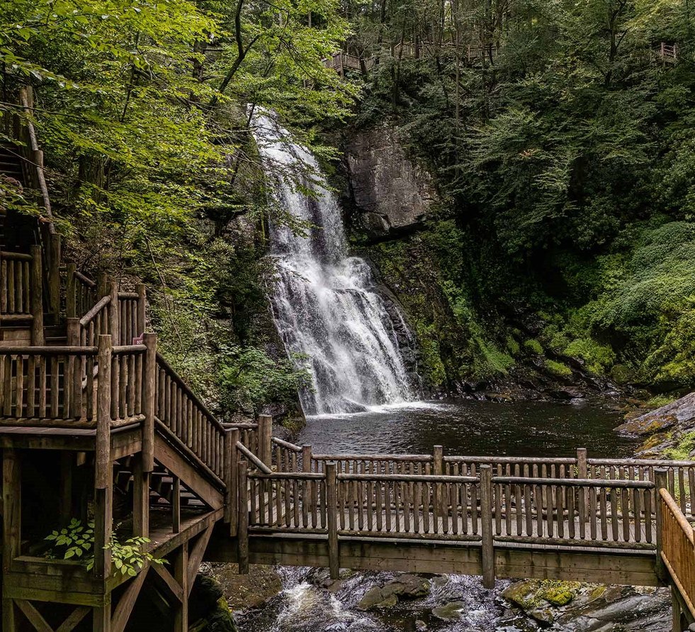 Waterfall and wooden boardwalk at Bushkill Falls in the Pocono Mountains